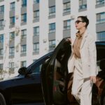 middle aged woman exiting car in urban environment 2026 01 11 10 50 56 utc