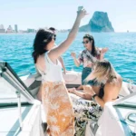 friends toasting drinks boat party1