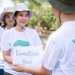 group asian diverse people volunteer holding donation box fundraiser emergency situation such as help ukraine flood victims food children charity eventvolunteering conceptual 1