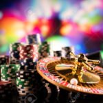 134731634 casino theme gambling games roulette and poker chips on a colorful bokeh background