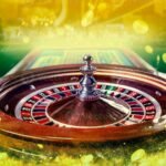 collage of casino images with a close up vibrant image of multicolored casino roulette table with poker chips photo