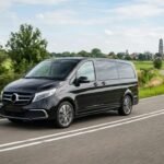 Luxury van driving on road 202608050413